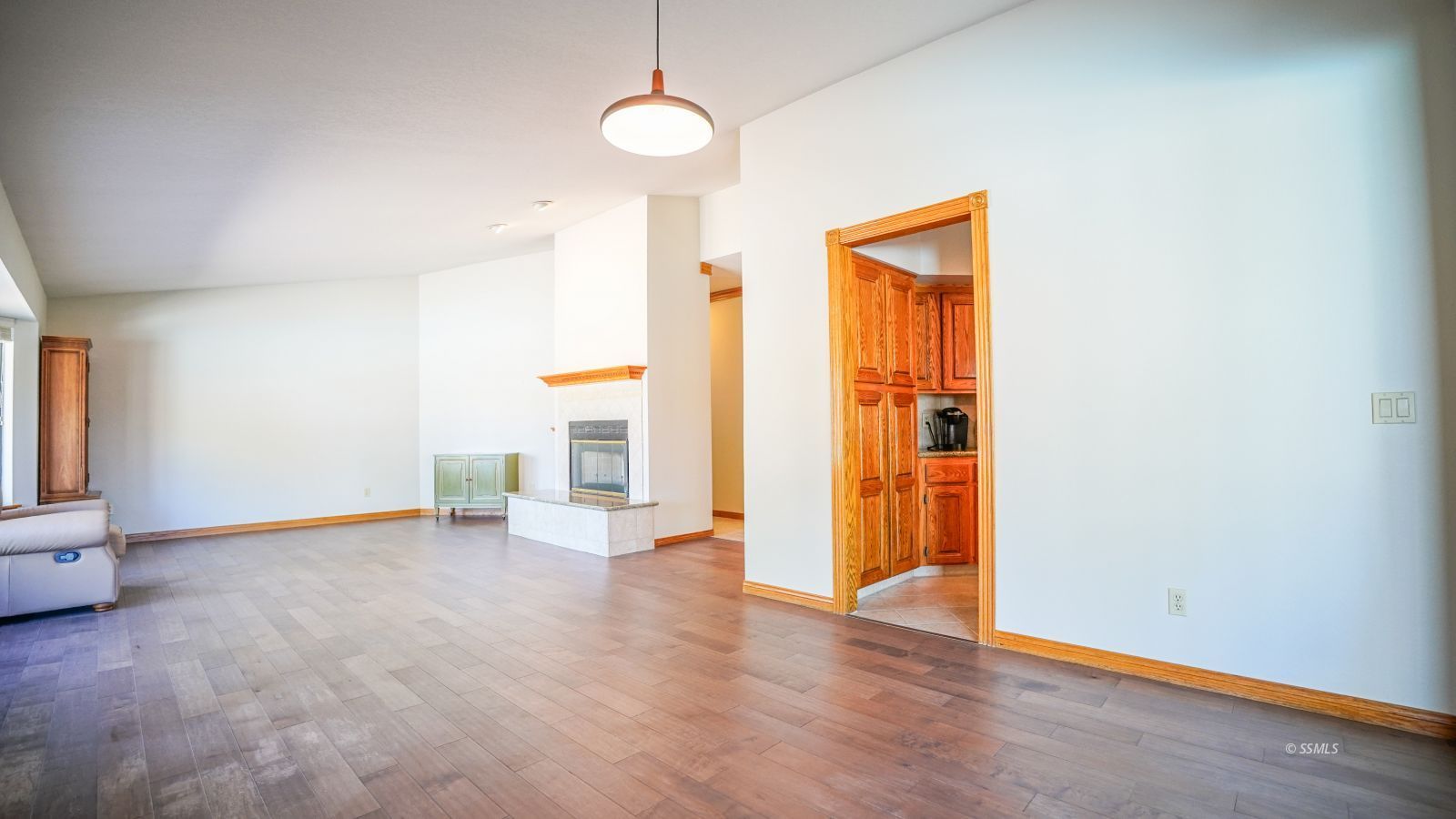 948 Hermosa Avenue Ridgecrest, CA 93555 - Photo 9 of 46 an empty room with wooden floor and windows