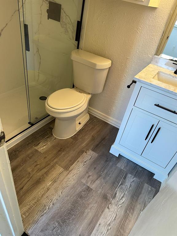 9825 Walnut Street, Unit 305 Dallas, TX 75243 - Photo 7 of 9 a bathroom with a toilet and a sink