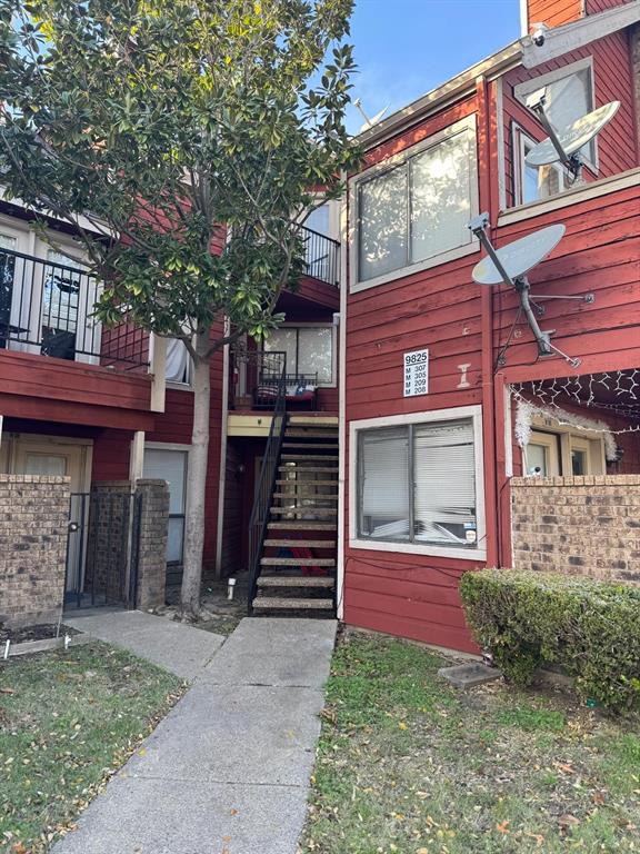 9825 Walnut Street, Unit 305 Dallas, TX 75243 - Photo 9 of 9 front view of a house with a yard