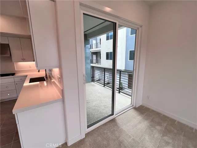 a bedroom with a bed and balcony