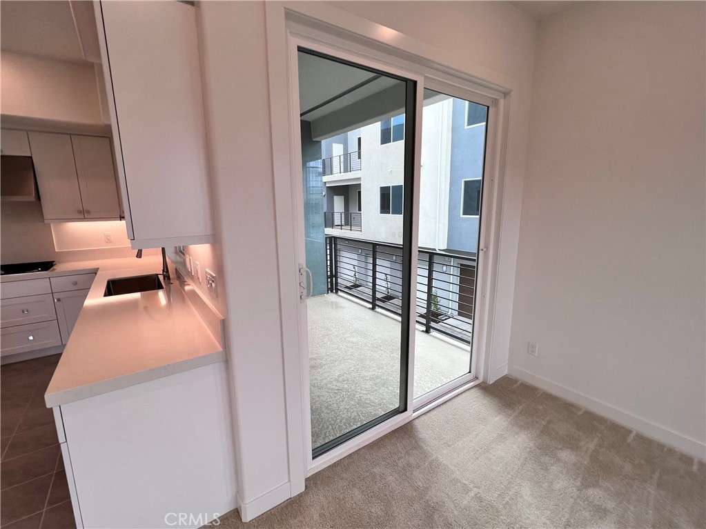 215 Sash Irvine, CA 92618 - Photo 3 of 31 a bedroom with a bed and balcony