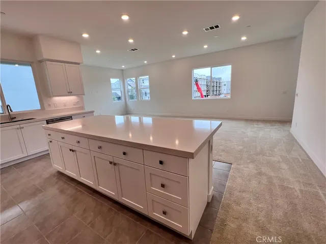 a view of a hallway with cabinet