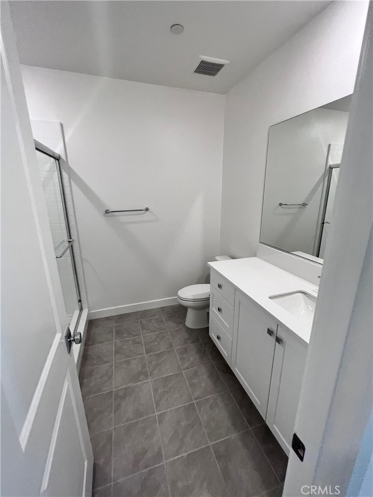 215 Sash Irvine, CA 92618 - Photo 6 of 31 a bathroom with a sink a toilet and a shower