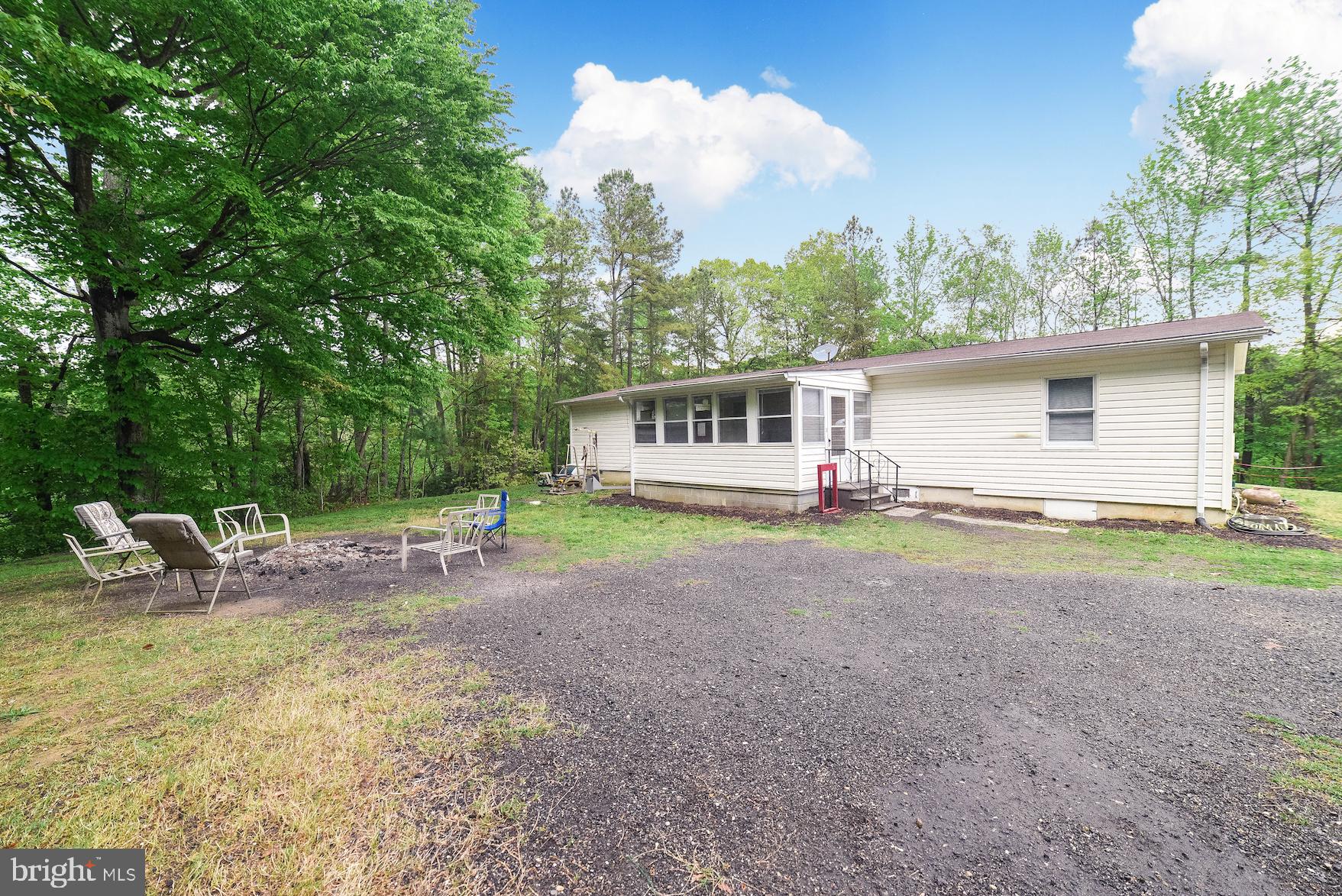 17067 St Peters Clavers Road Ridge, MD 20680 - Photo 4 of 28 Backyard with fire pit and extra parking