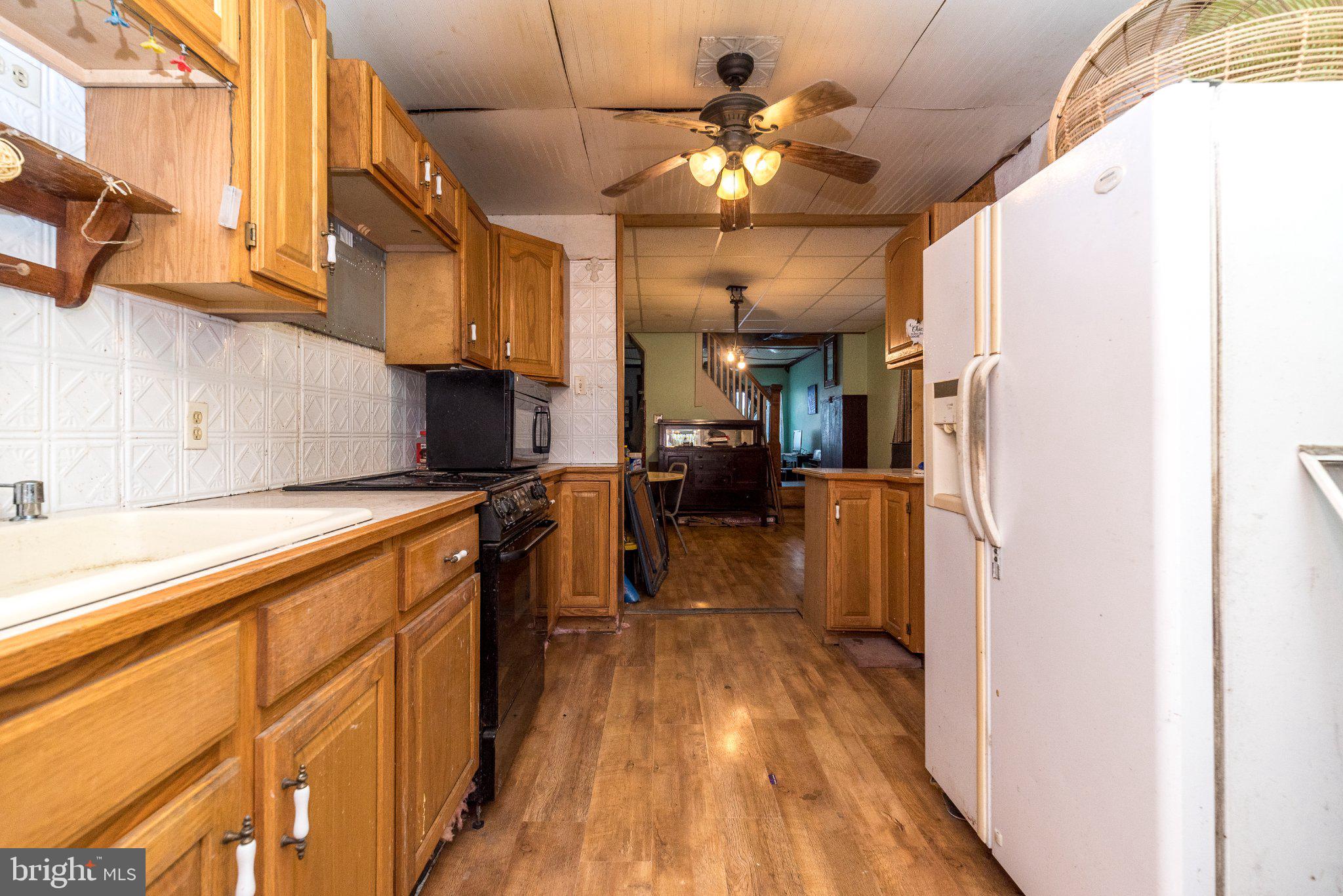 514 McKnight Street Gordon, PA 17921 - Photo 8 of 22 Cozy kitchen with warm wooden tones.