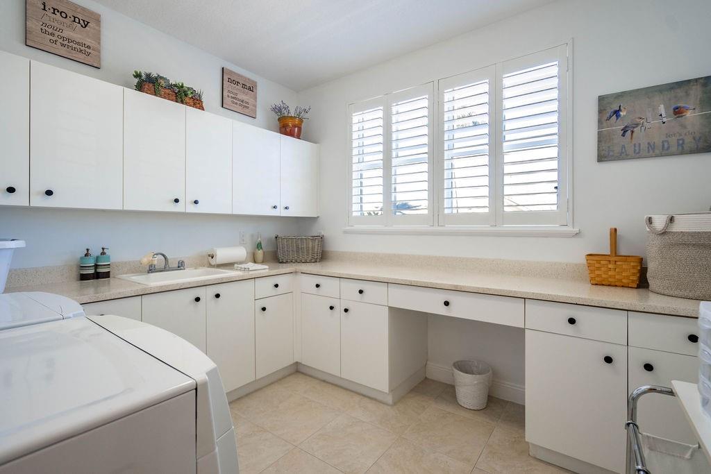 2825 Marina Circle, Unit 2825 Lighthouse Point, FL 33064 - Photo 15 of 48 a kitchen with cabinets appliances a sink and a window
