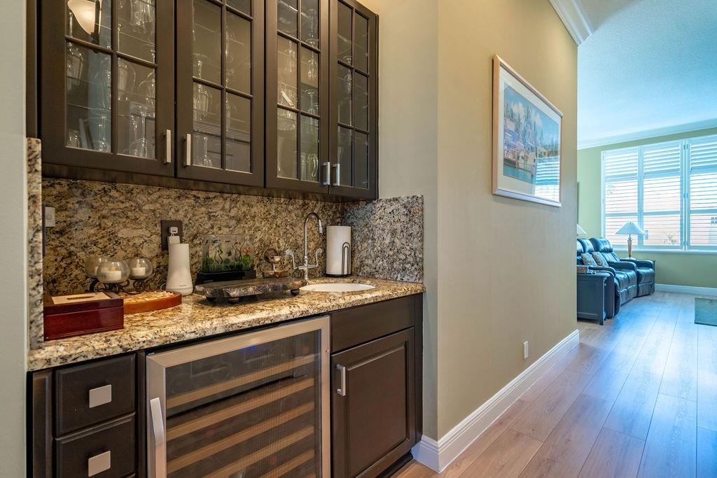 2825 Marina Circle, Unit 2825 Lighthouse Point, FL 33064 - Photo 19 of 48 a kitchen with stainless steel appliances granite countertop a sink stove and cabinets