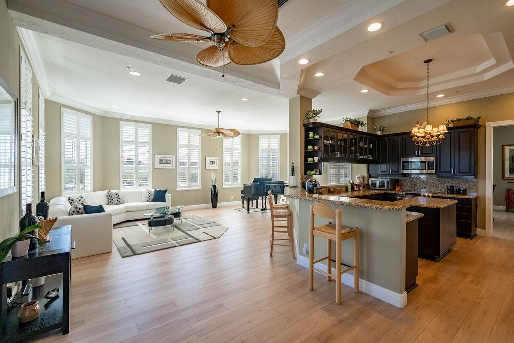 2825 Marina Circle, Unit 2825 Lighthouse Point, FL 33064 - Photo 20 of 48 a large open kitchen with a large window and stainless steel appliances