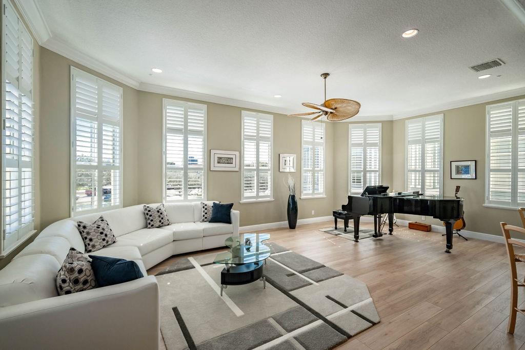 2825 Marina Circle, Unit 2825 Lighthouse Point, FL 33064 - Photo 21 of 48 a living room with furniture and a large window