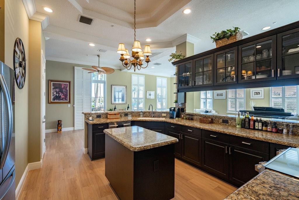 2825 Marina Circle, Unit 2825 Lighthouse Point, FL 33064 - Photo 22 of 48 a kitchen with a sink a counter space and stainless steel appliances