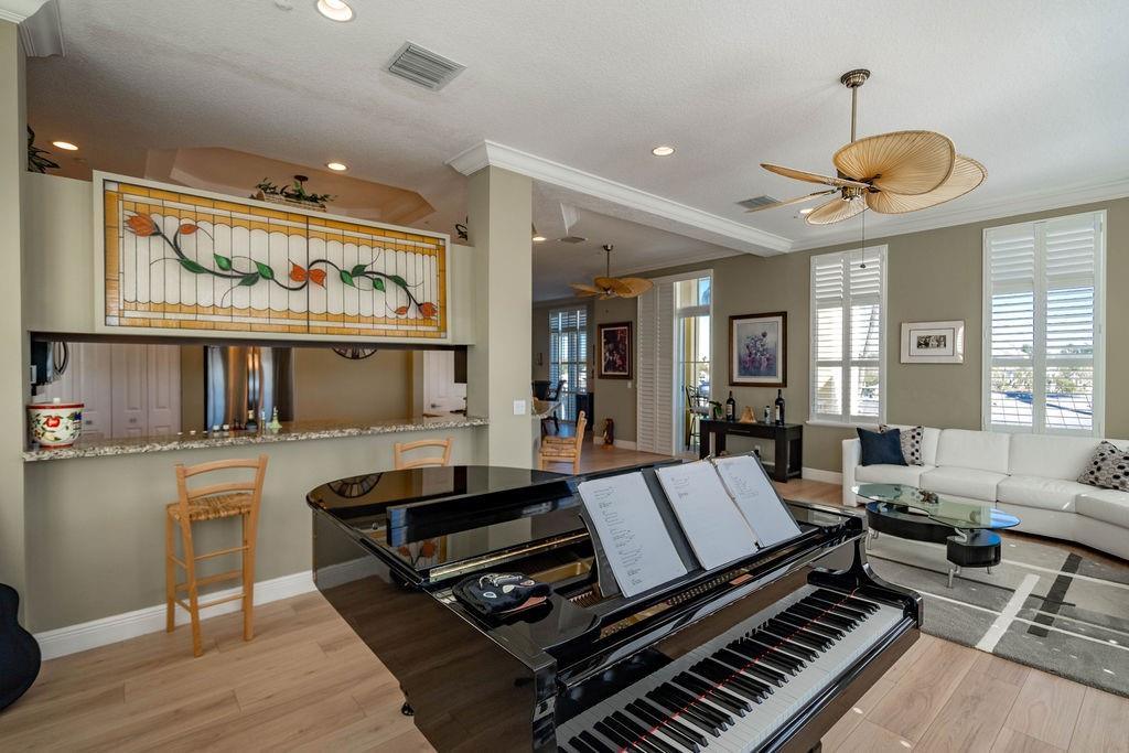2825 Marina Circle, Unit 2825 Lighthouse Point, FL 33064 - Photo 24 of 48 a living room with furniture a rug and a window
