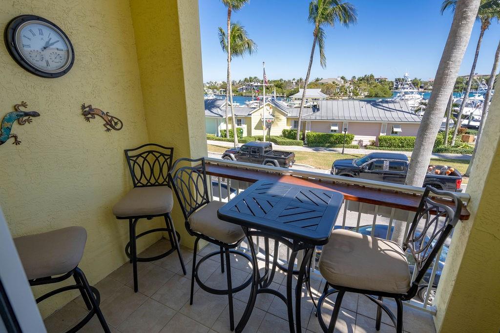 2825 Marina Circle, Unit 2825 Lighthouse Point, FL 33064 - Photo 26 of 48 a view of a dining room with furniture and window