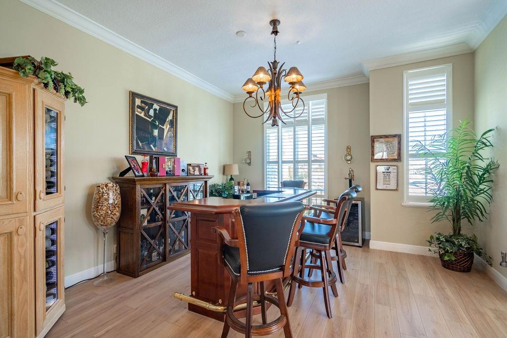 2825 Marina Circle, Unit 2825 Lighthouse Point, FL 33064 - Photo 29 of 48 a view of a dining room and livingroom with furniture wooden floor a chandelier