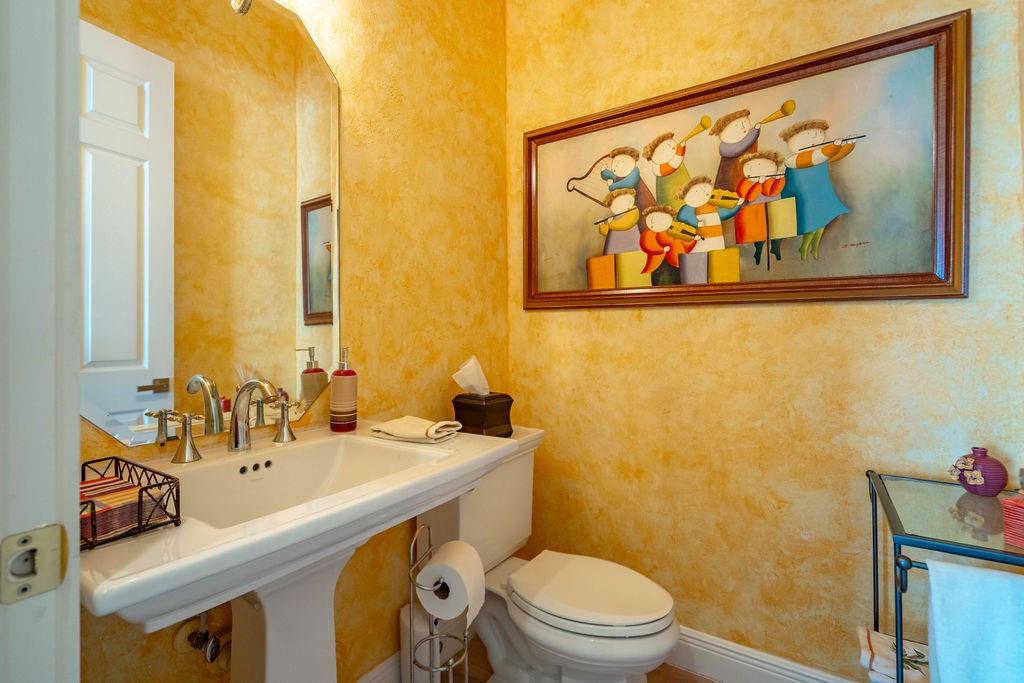 2825 Marina Circle, Unit 2825 Lighthouse Point, FL 33064 - Photo 31 of 48 a bathroom with a sink mirror vanity and toilet