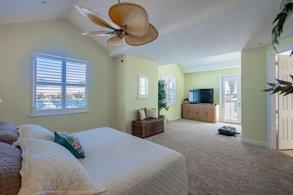 2825 Marina Circle, Unit 2825 Lighthouse Point, FL 33064 - Photo 33 of 48 a bedroom with furniture and a window