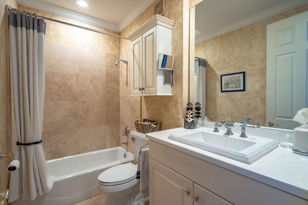 2825 Marina Circle, Unit 2825 Lighthouse Point, FL 33064 - Photo 40 of 48 a bathroom with a sink a toilet and a bathtub