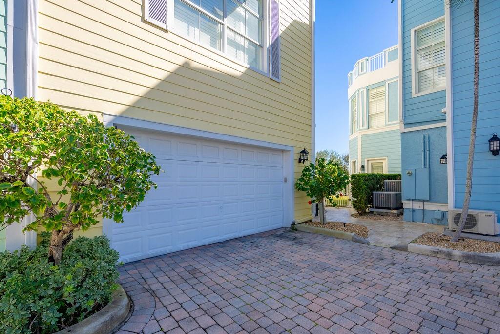2825 Marina Circle, Unit 2825 Lighthouse Point, FL 33064 - Photo 42 of 48 a view of a house with a yard and plants