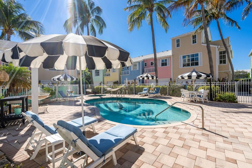 2825 Marina Circle, Unit 2825 Lighthouse Point, FL 33064 - Photo 43 of 48 a view of a patio with swimming pool table and chairs