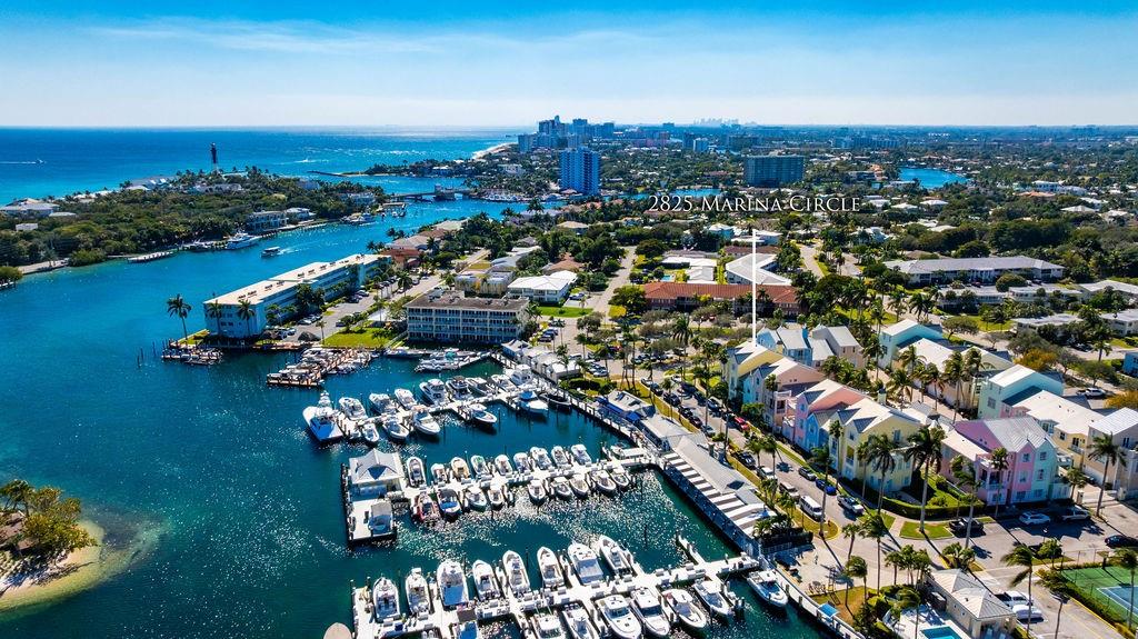 2825 Marina Circle, Unit 2825 Lighthouse Point, FL 33064 - Photo 48 of 48 an aerial view of a city with lots of residential buildings ocean and mountain view in back