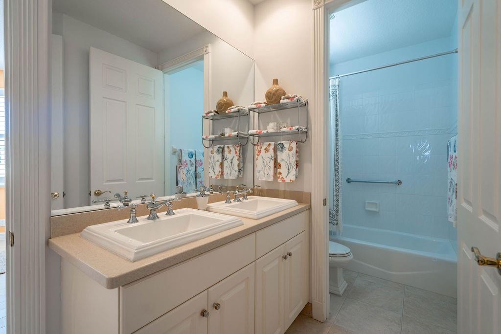 2825 Marina Circle, Unit 2825 Lighthouse Point, FL 33064 - Photo 10 of 48 a bathroom with a sink toilet tub and shower