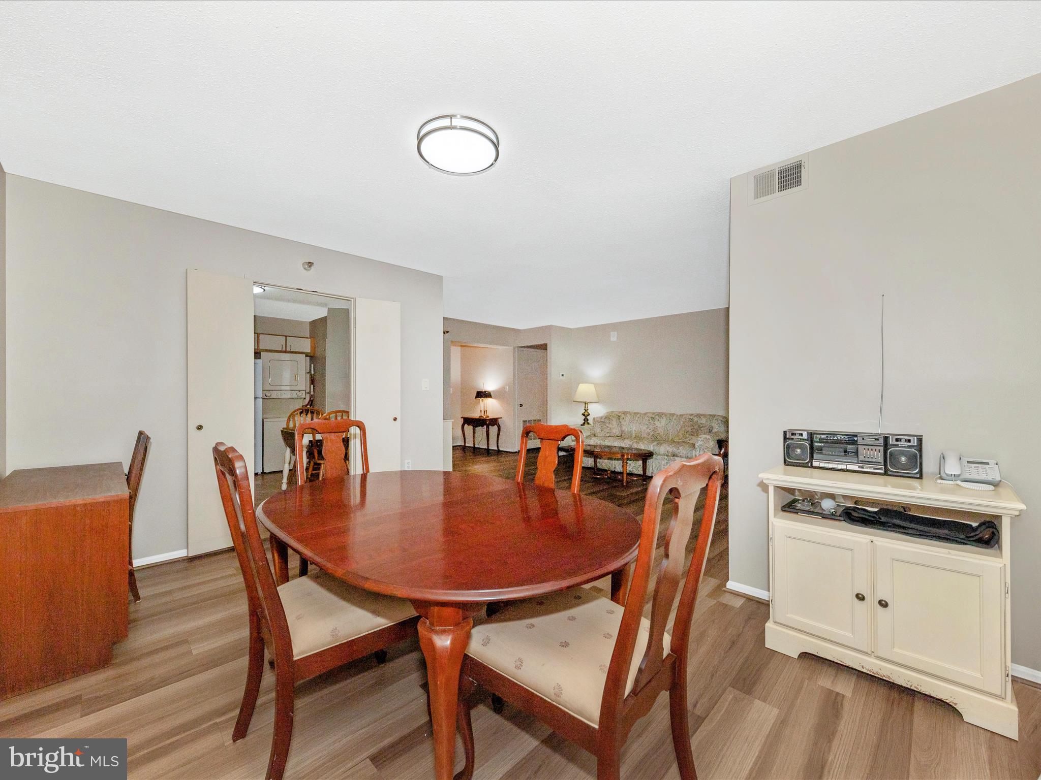 15101 Interlachen Drive, Unit 1116 Silver Spring, MD 20906 - Photo 13 of 78 a view of a dining room with furniture