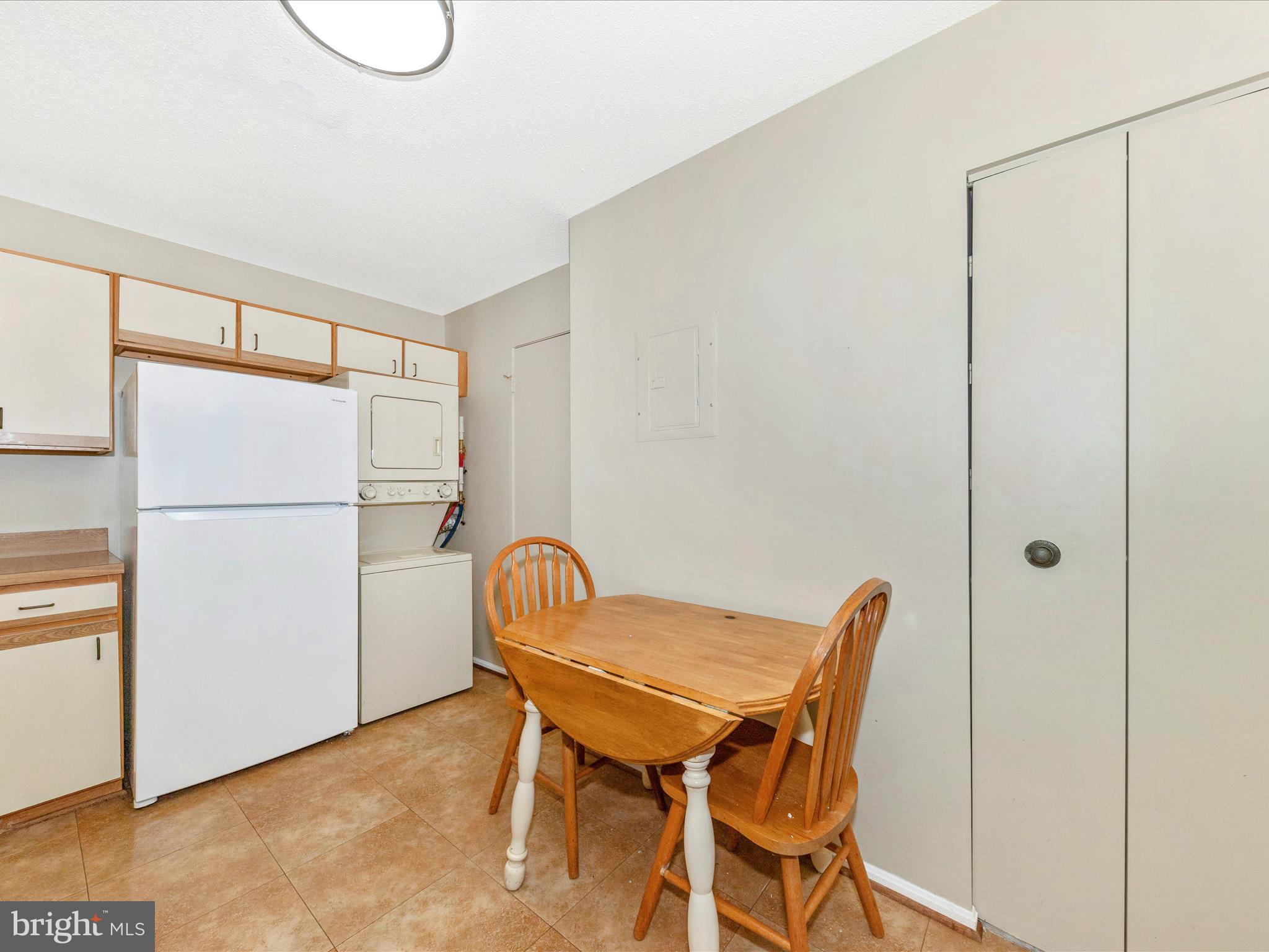 15101 Interlachen Drive, Unit 1116 Silver Spring, MD 20906 - Photo 17 of 78 a view of a room with table and chairs