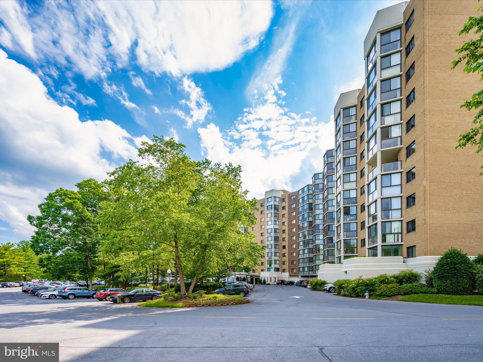 15101 Interlachen Drive, Unit 1116 Silver Spring, MD 20906 - Photo 34 of 78 a city street lined with buildings and trees