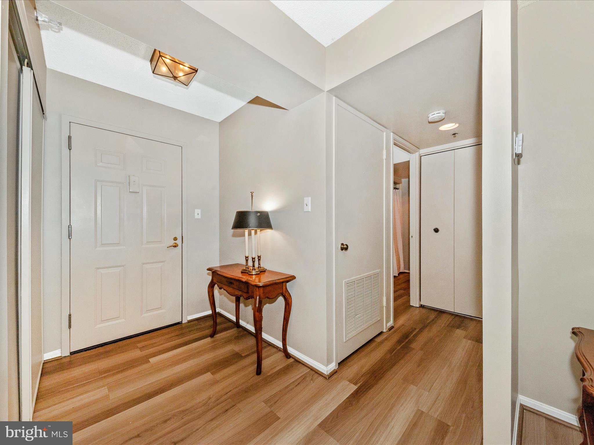 15101 Interlachen Drive, Unit 1116 Silver Spring, MD 20906 - Photo 4 of 78 a view of a hallway and wooden floor
