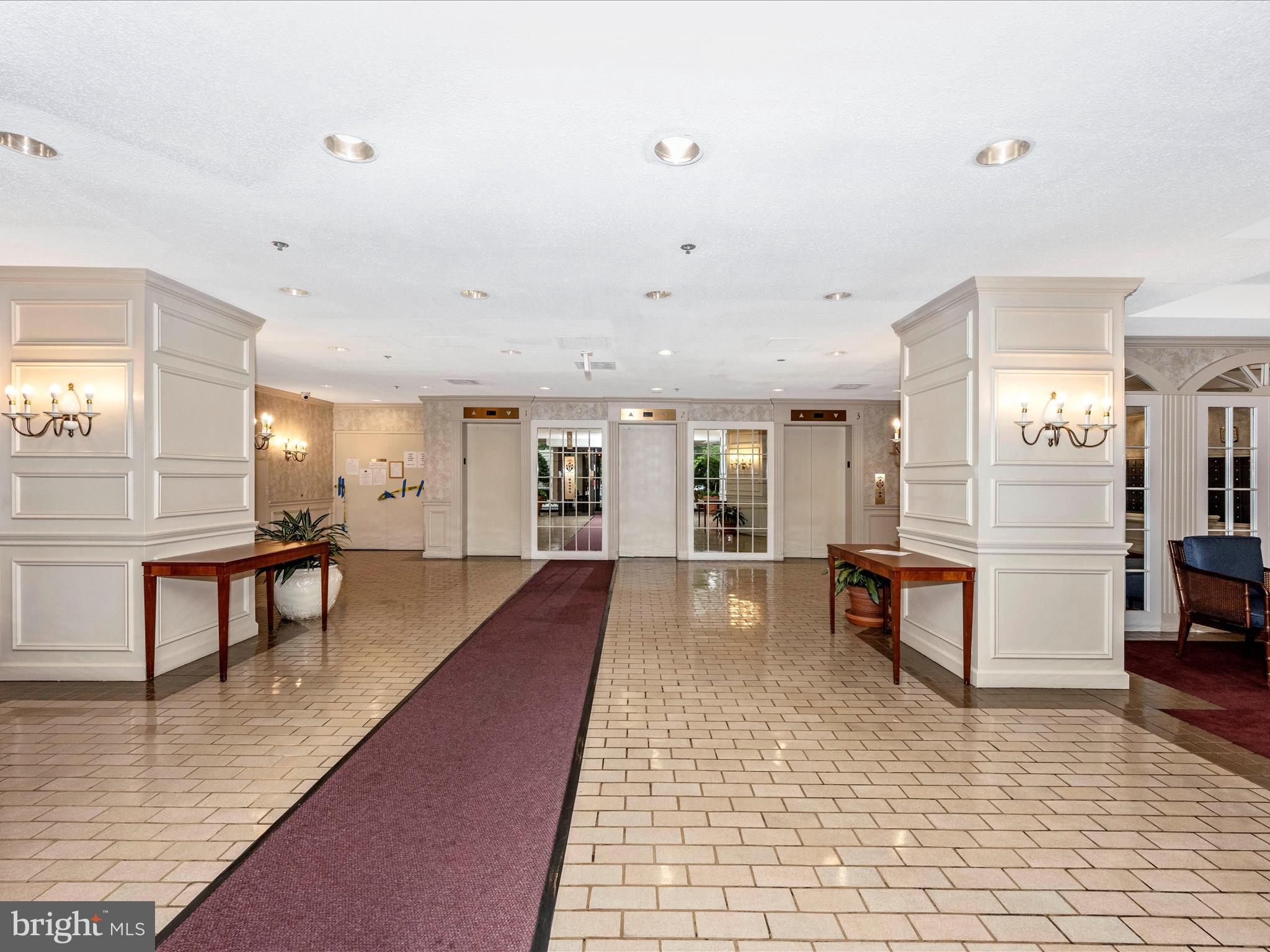 15101 Interlachen Drive, Unit 1116 Silver Spring, MD 20906 - Photo 44 of 78 a lobby with furniture and wooden floor