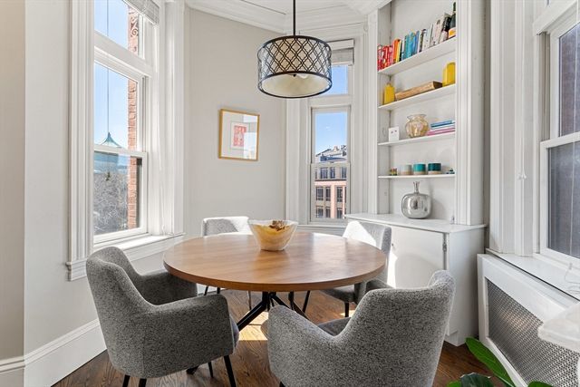 a view of a dining room with furniture window and outside view