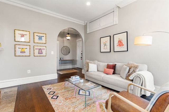 a living room with furniture and a table