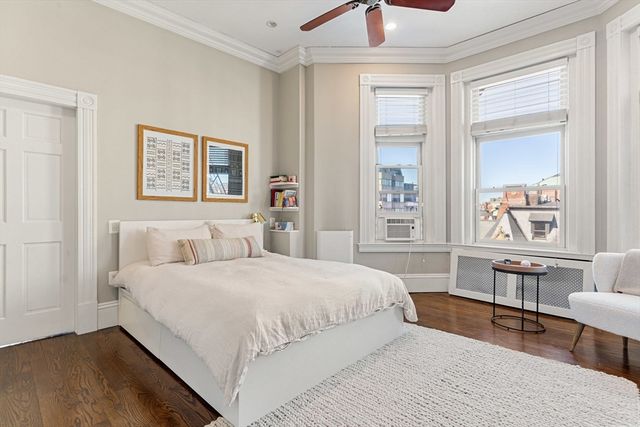 a bedroom with a bed and a table