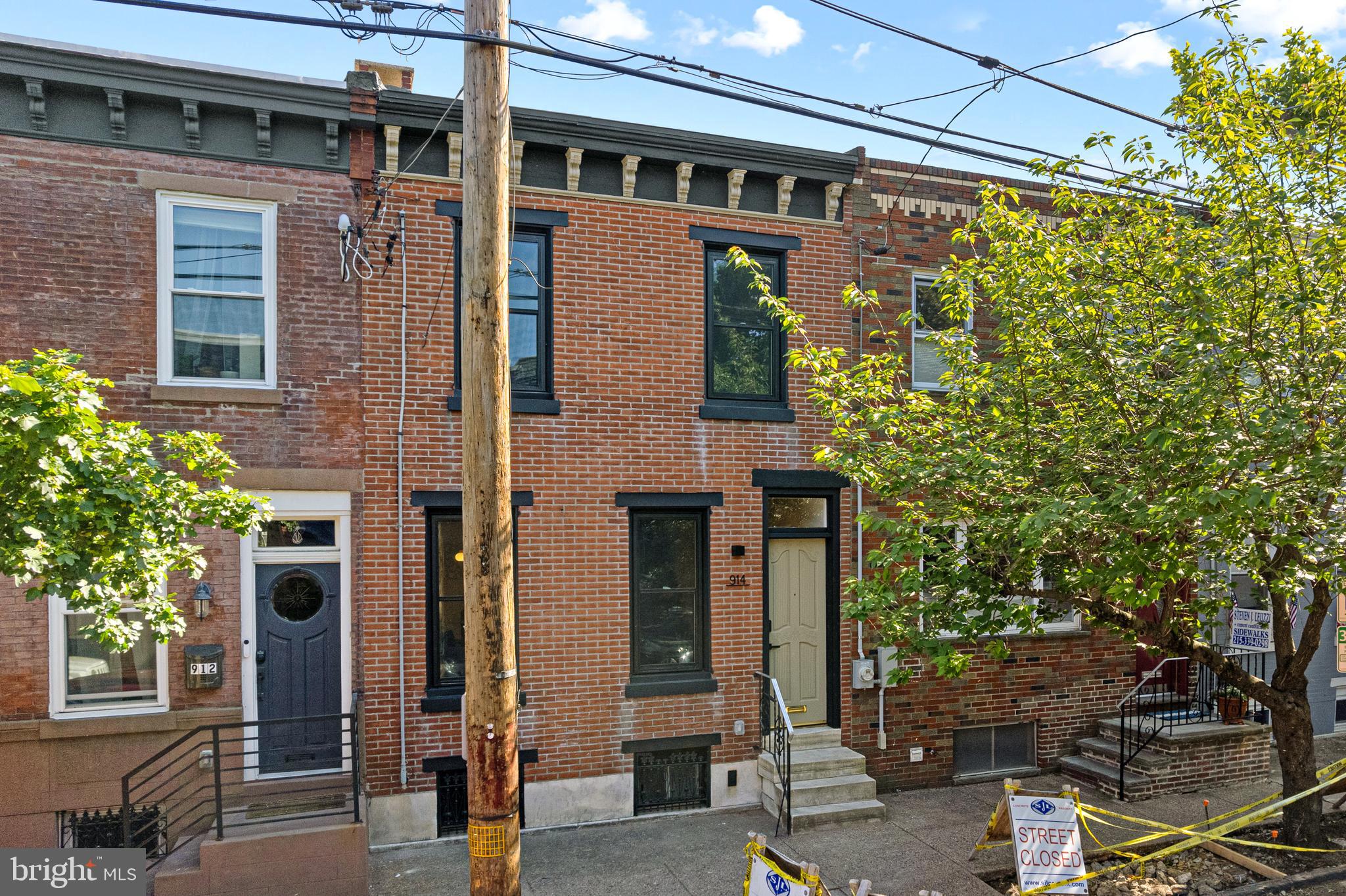914 Moore Street Philadelphia, PA 19148 - Photo 1 of 26 a front view of a building with a garden