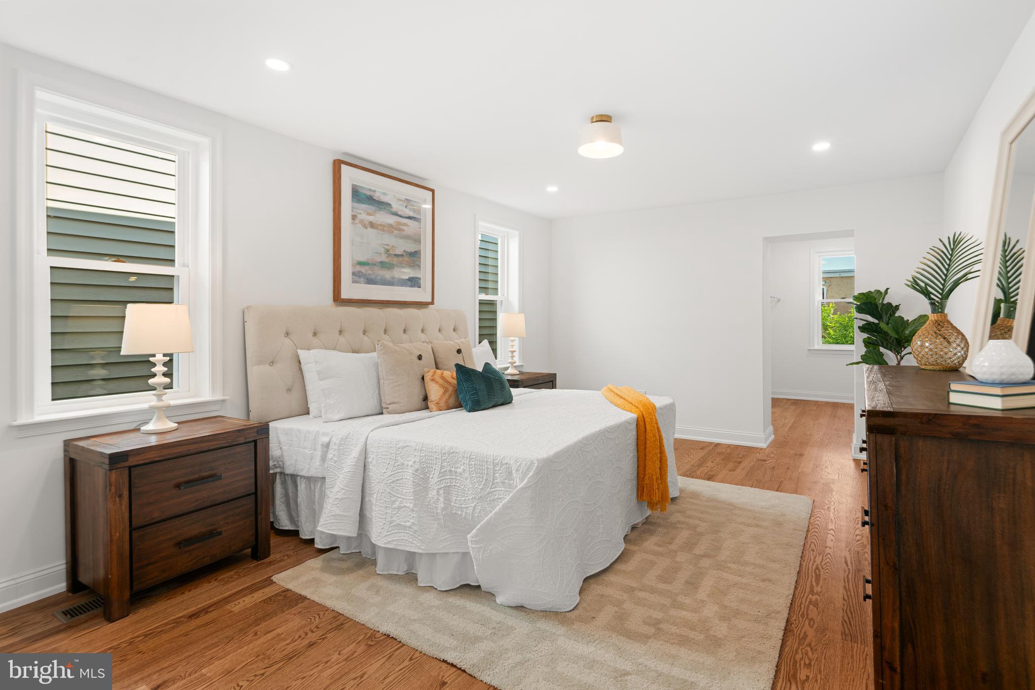 914 Moore Street Philadelphia, PA 19148 - Photo 13 of 26 a bedroom with a bed and wooden floor