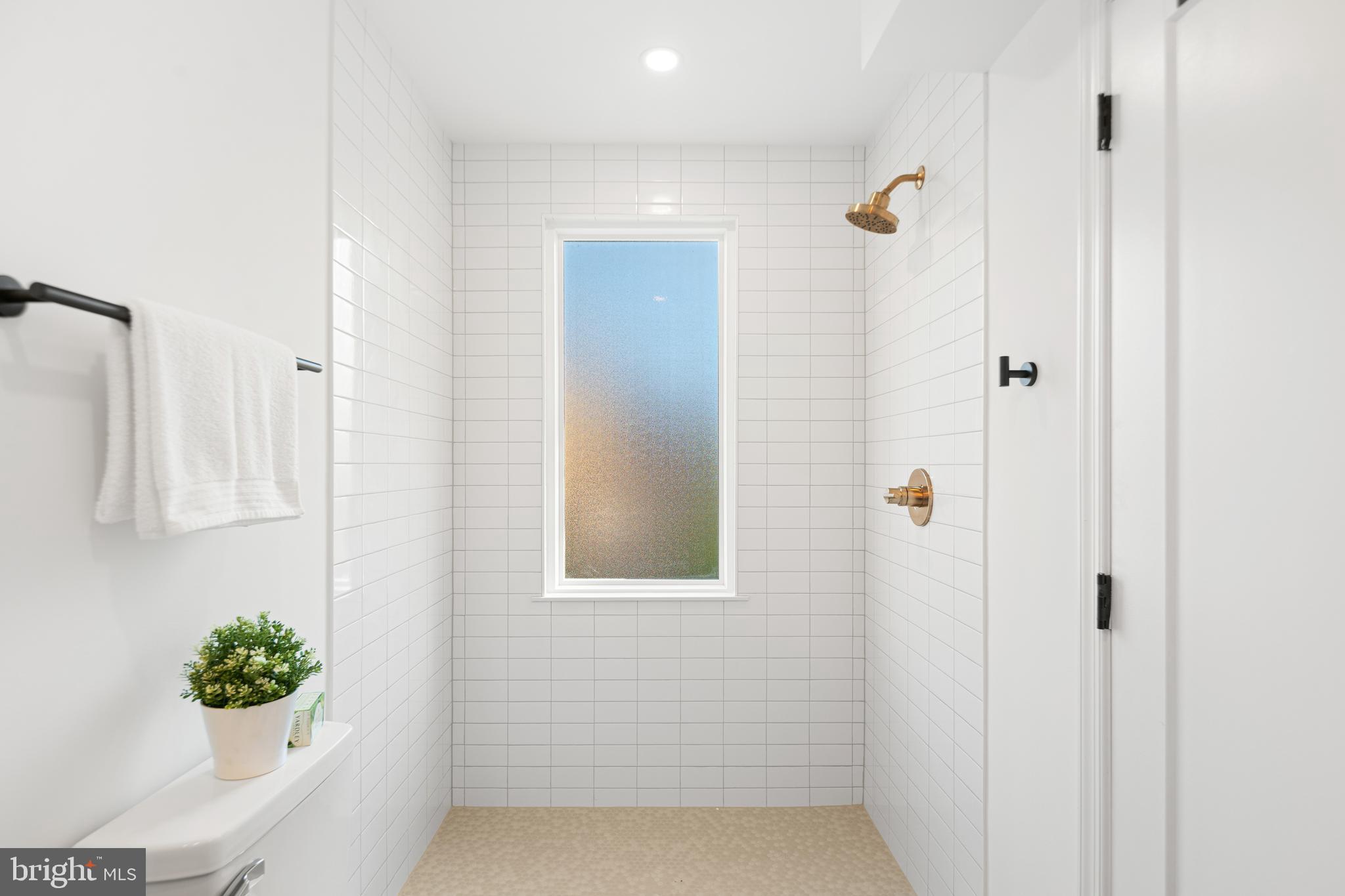 914 Moore Street Philadelphia, PA 19148 - Photo 17 of 26 a bathroom with a shower