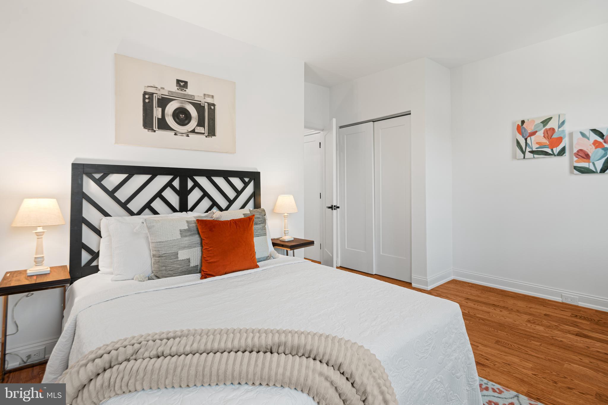 914 Moore Street Philadelphia, PA 19148 - Photo 21 of 26 a bedroom with a bed and wooden floor