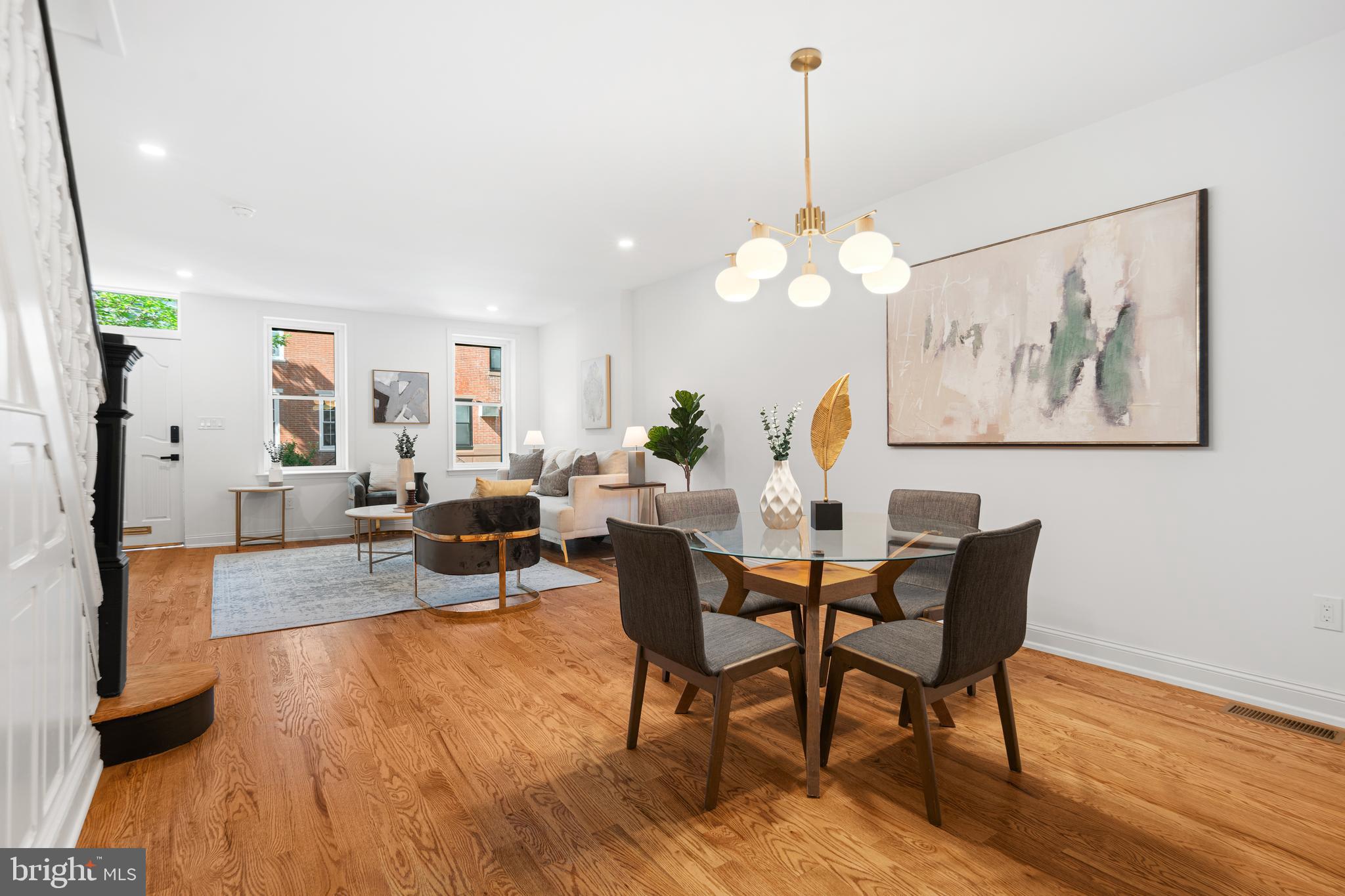 914 Moore Street Philadelphia, PA 19148 - Photo 5 of 26 a view of a dining room with furniture wooden floor and a chandelier