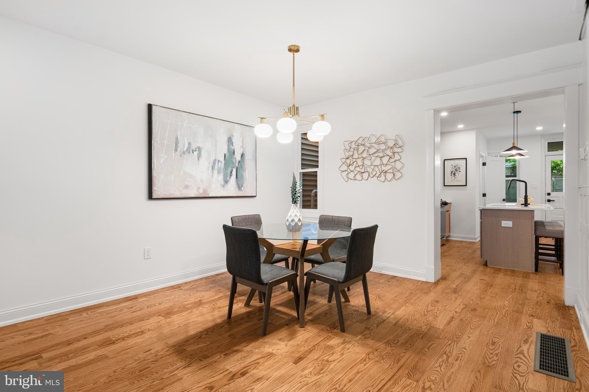 914 Moore Street Philadelphia, PA 19148 - Photo 6 of 26 a view of a dining room with furniture window and wooden floor