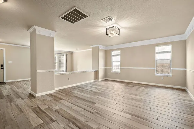 a bathroom with a toilet a sink a mirror and vanity