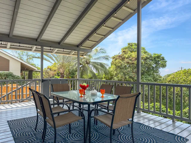 a view of balcony with furniture