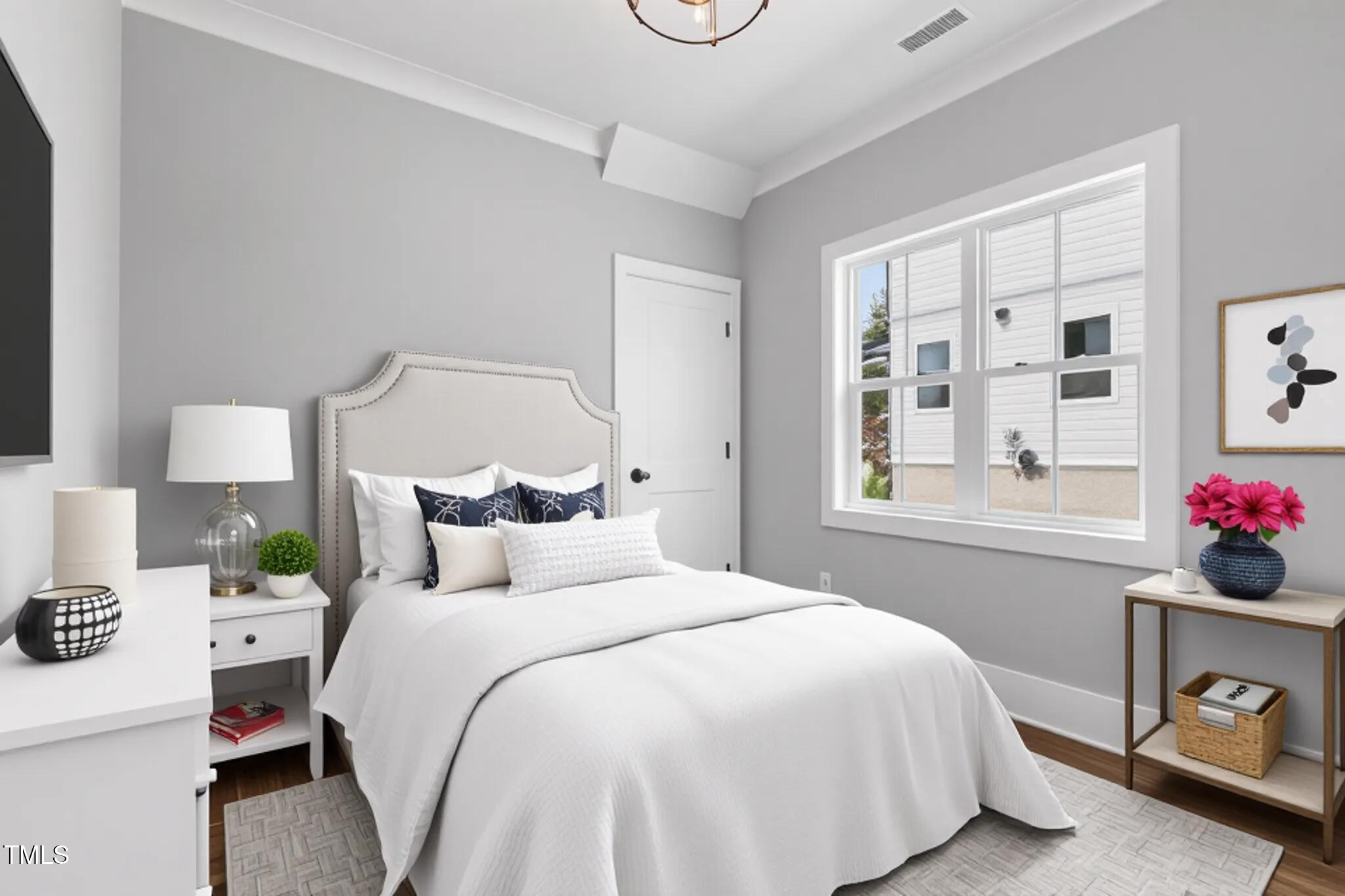 2521 Newbold Street Raleigh, NC 27603 - Photo 20 of 40 a bedroom with a bed and a window