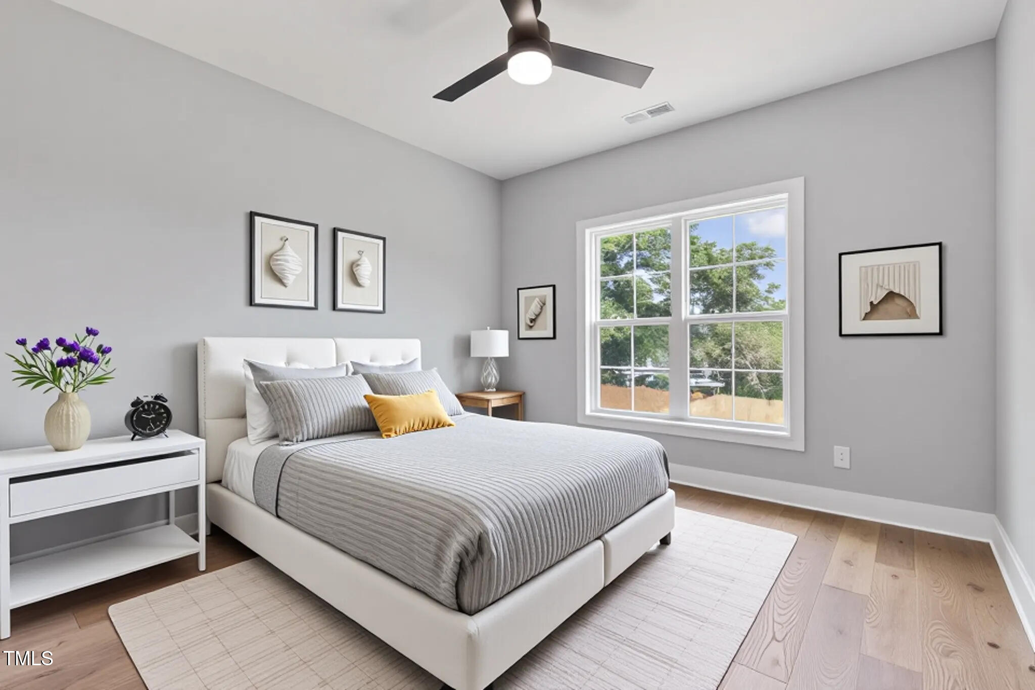 2521 Newbold Street Raleigh, NC 27603 - Photo 29 of 40 a bedroom with a large bed and a window