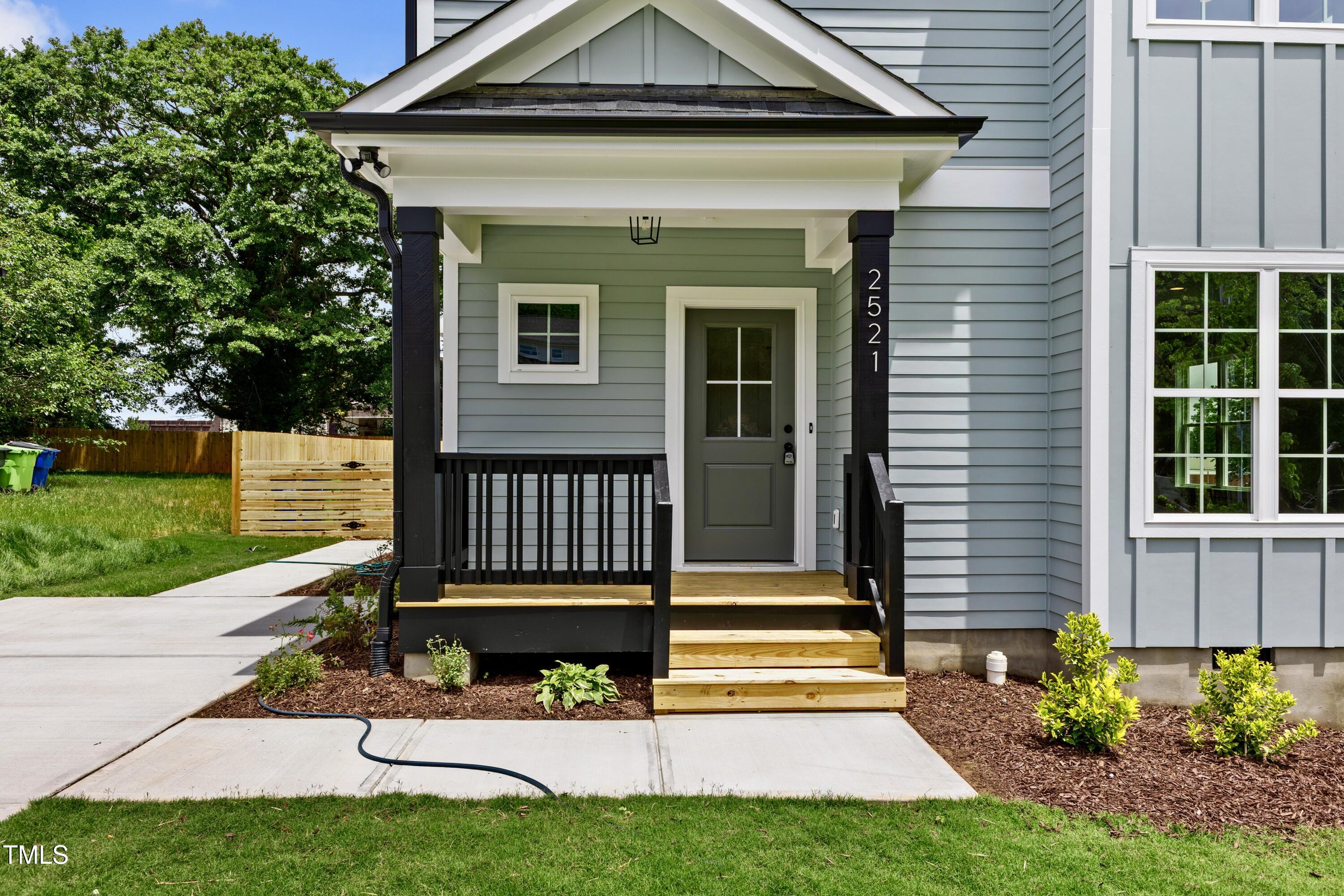 2521 Newbold Street Raleigh, NC 27603 - Photo 7 of 40 a view of a house with a yard and plants
