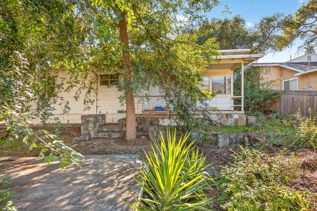 a view of a garden with patio