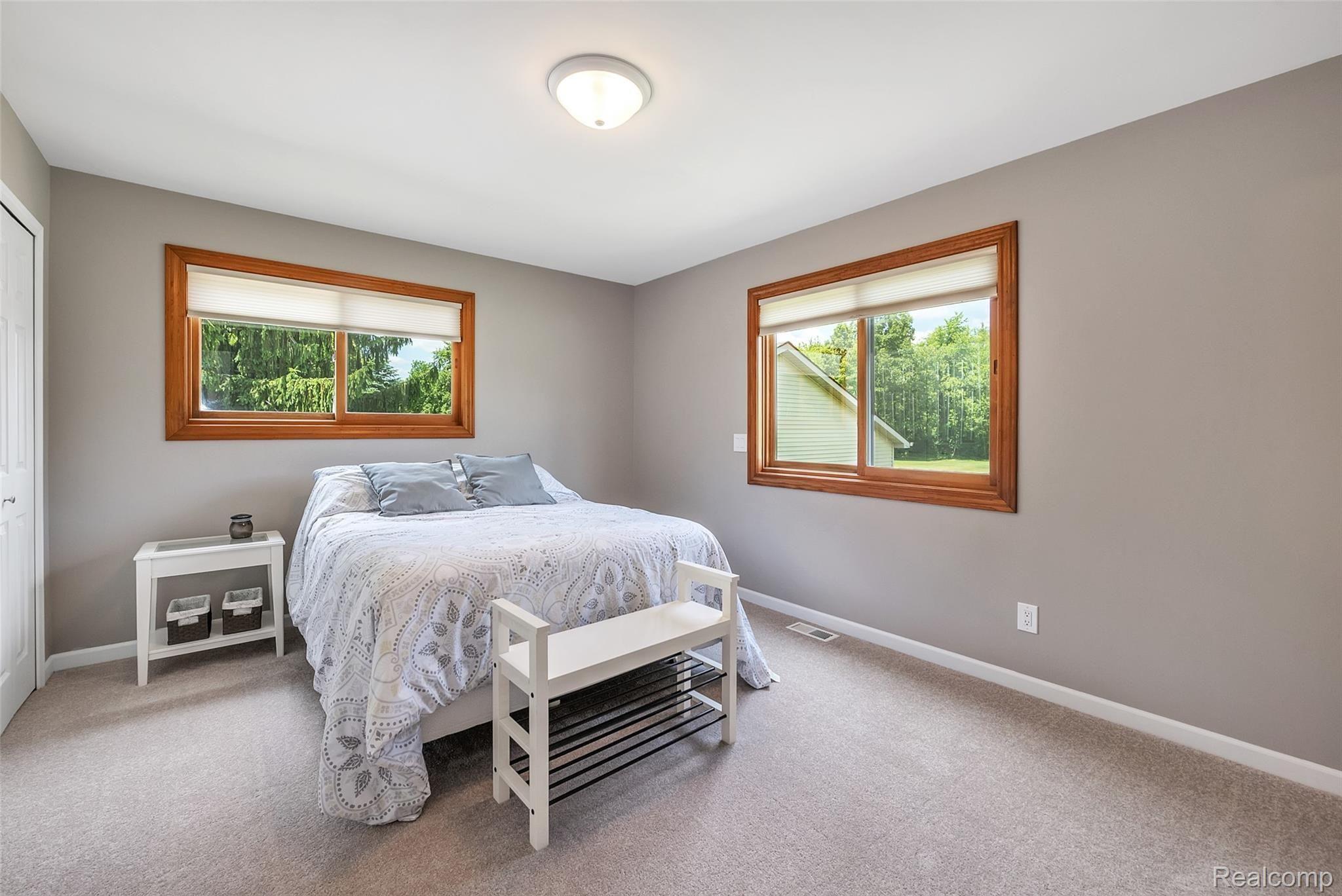 4054 Bennett Lake Road Fenton, MI 48430 - Photo 23 of 57 2nd Level Master Bedroom ~ New Carpet & Paint ~ Access to Activate Exterior Security Lights from Bedroom