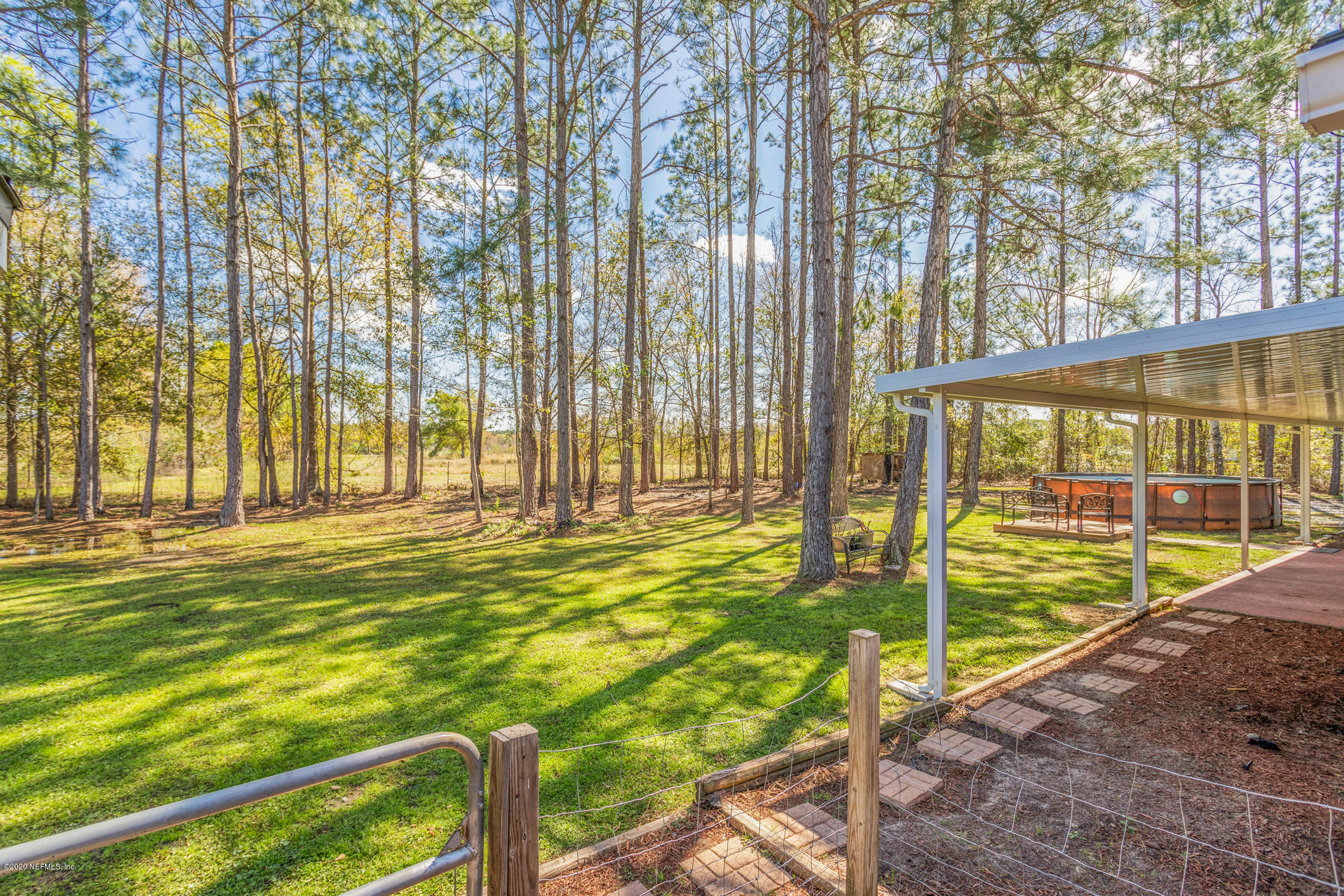 54324 Cravey Road Callahan, FL 32011 - Photo 10 of 48 a view of swimming pool with an outdoor space and seating area