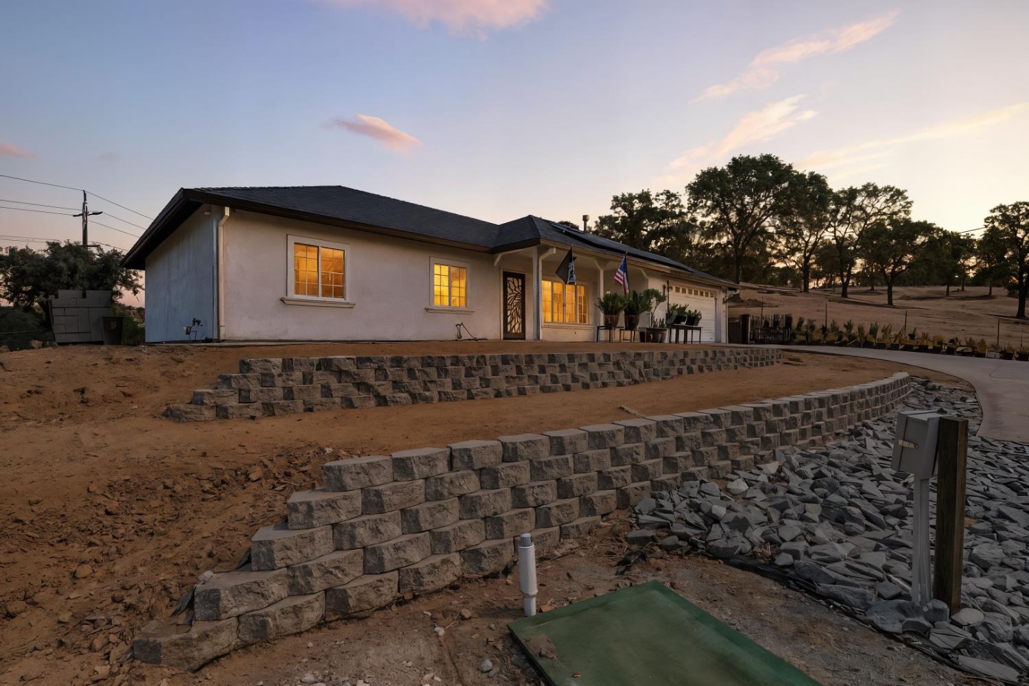 5939 Garner Place Valley Springs, CA 95252 - Photo 1 of 40 a front view of a house with a yard