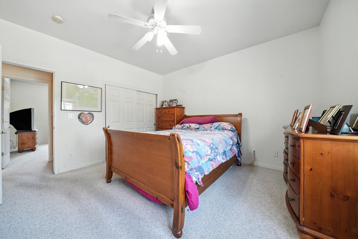 5939 Garner Place Valley Springs, CA 95252 - Photo 21 of 40 a bedroom with a bed and a tv