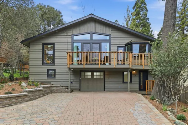 a front view of a house with yard