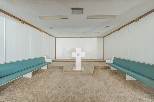 a living room with lots of furniture and a chandelier